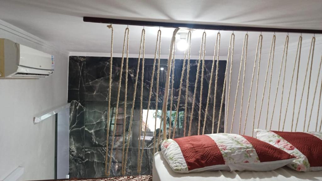 Postel nebo postele na pokoji v ubytování Kitnet MiniHouse do Alto