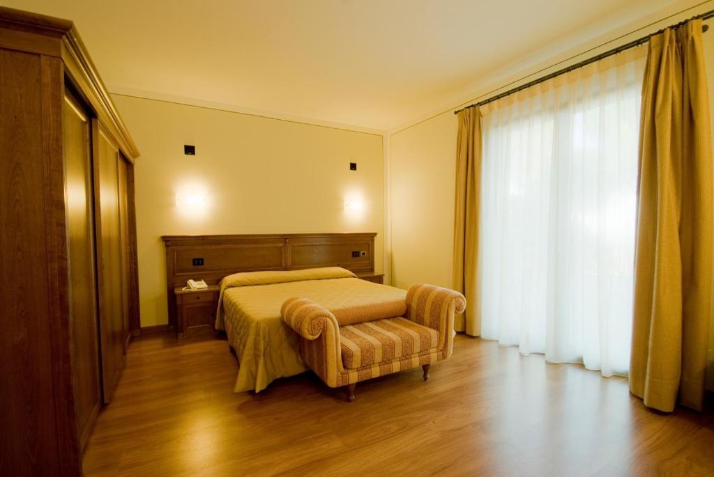 Posteľ alebo postele v izbe v ubytovaní Hotel Panoramic Montepulciano