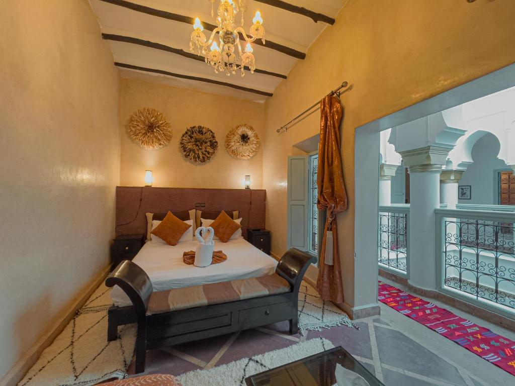 Postel nebo postele na pokoji v ubytování Riad L'Orchidée Suites & Spa