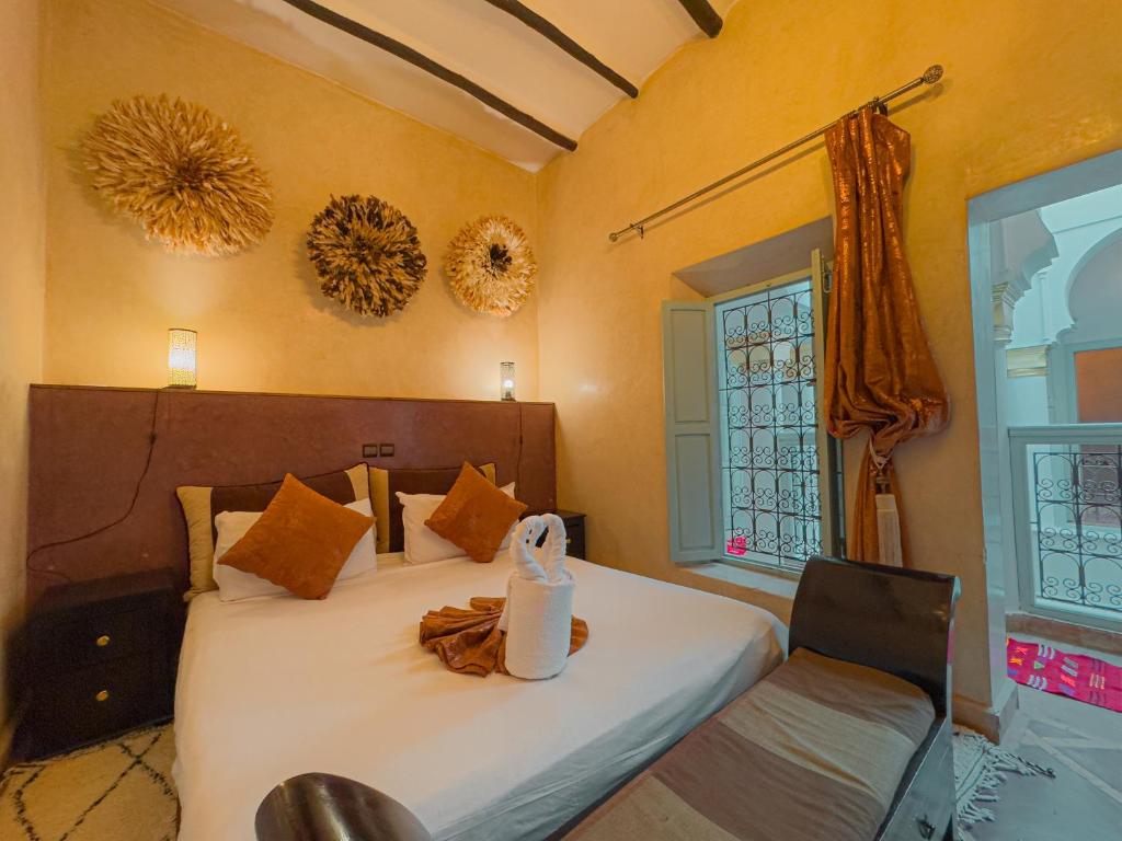 Postel nebo postele na pokoji v ubytování Riad L'Orchidée Suites & Spa