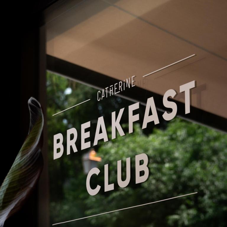 a sign on a window that reads breakfast club at Palais Ségurane Boutique Hôtel in Nice