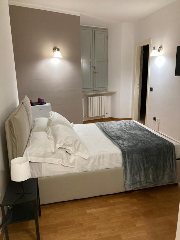 Postel nebo postele na pokoji v ubytování Residenza Palazzo Jona