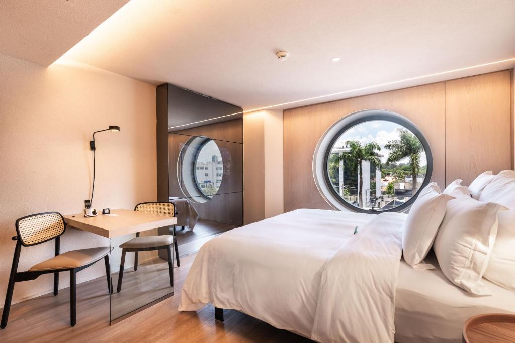 Postel nebo postele na pokoji v ubytování Hotel Unique
