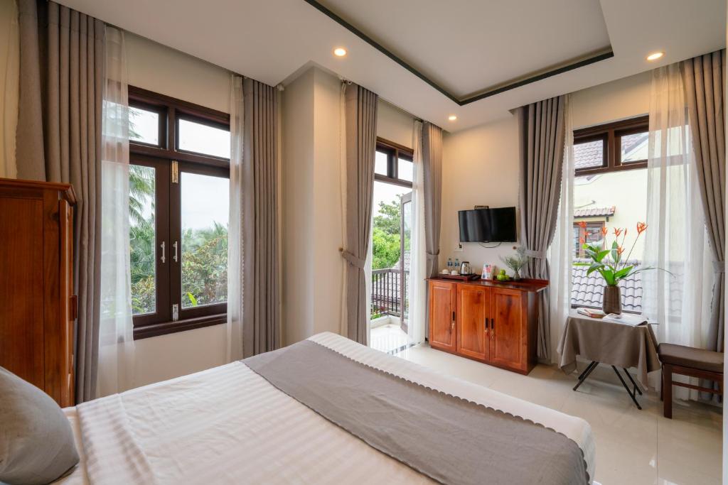TV a/nebo společenská místnost v ubytování Phuoc Dat Riverside Homestay Hoi An