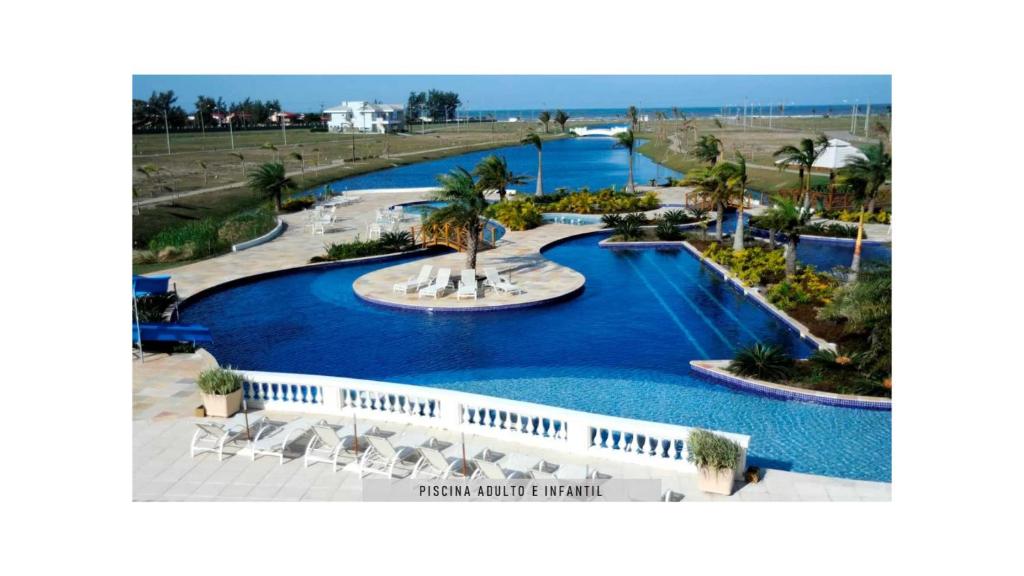 an aerial view of a resort swimming pool at Casa Condomínio Ocean Side Alto Padrão - Pé na Areia in Torres