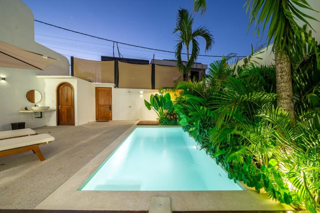 a swimming pool in the backyard of a house at Darina - Brand-New Villa Just Minutes from the Beach with a Huge Pool in Badung