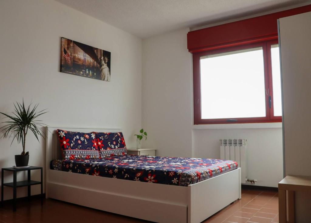 Postel nebo postele na pokoji v ubytování Ciao Brescia