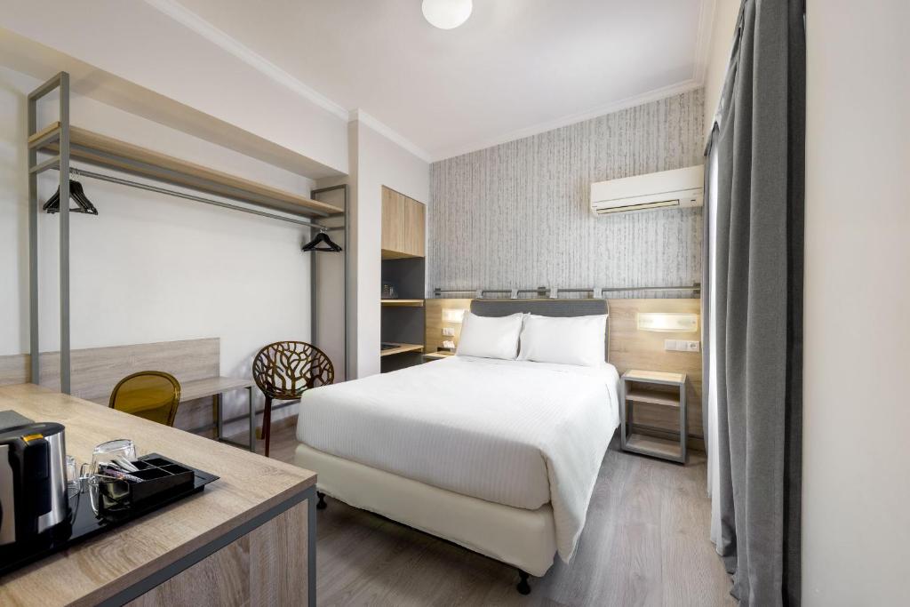 Posteľ alebo postele v izbe v ubytovaní Pan Hotel