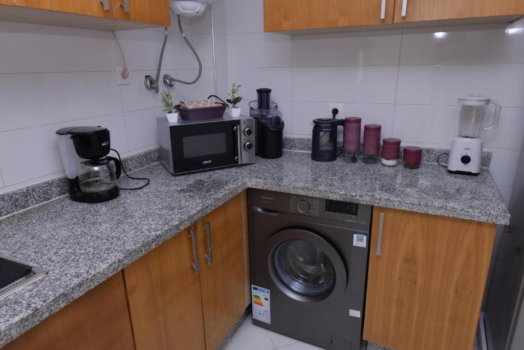 Kuchyň nebo kuchyňský kout v ubytování Cozy Duplex appartement wifi parking proximité