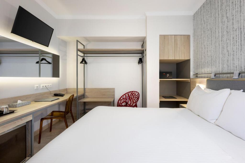 Posteľ alebo postele v izbe v ubytovaní Pan Hotel