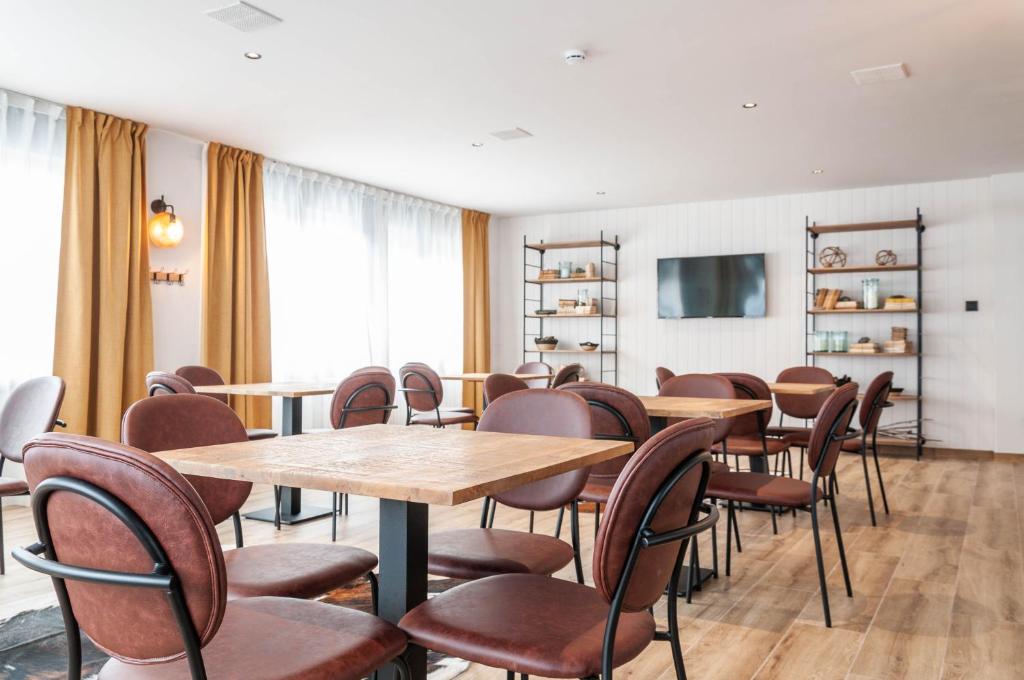 TV a/nebo společenská místnost v ubytování Hotel Viella
