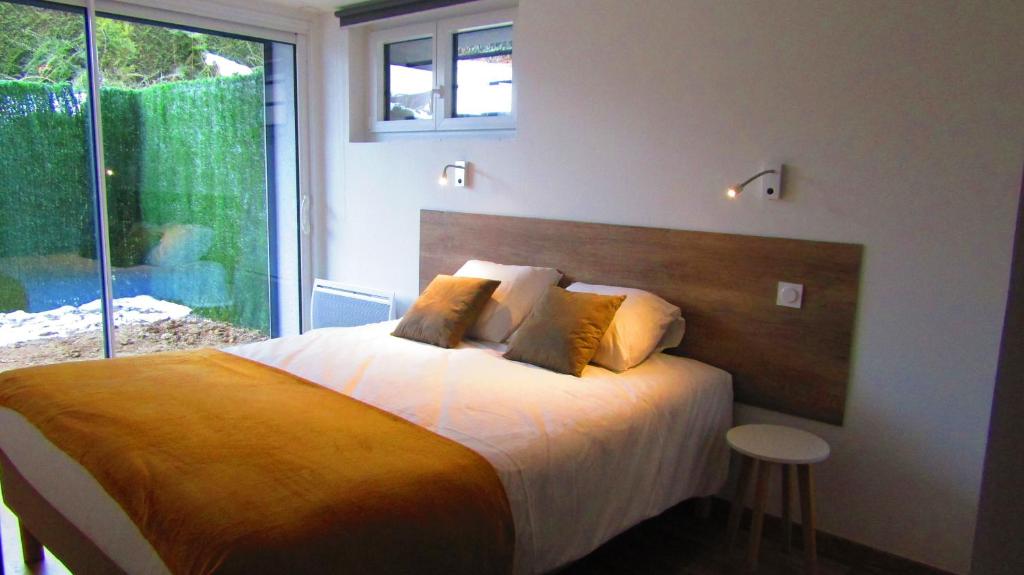 Postel nebo postele na pokoji v ubytování Appartement Semnoz - Vue Lac