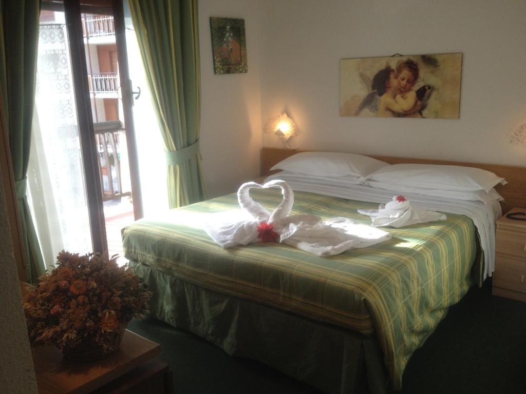 Łóżko lub łóżka w pokoju w obiekcie Hotel San Giorgio