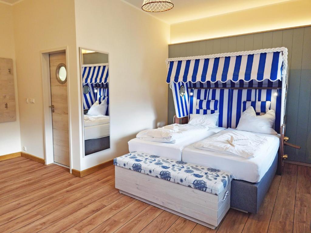 Postel nebo postele na pokoji v ubytování Wangerland Resort