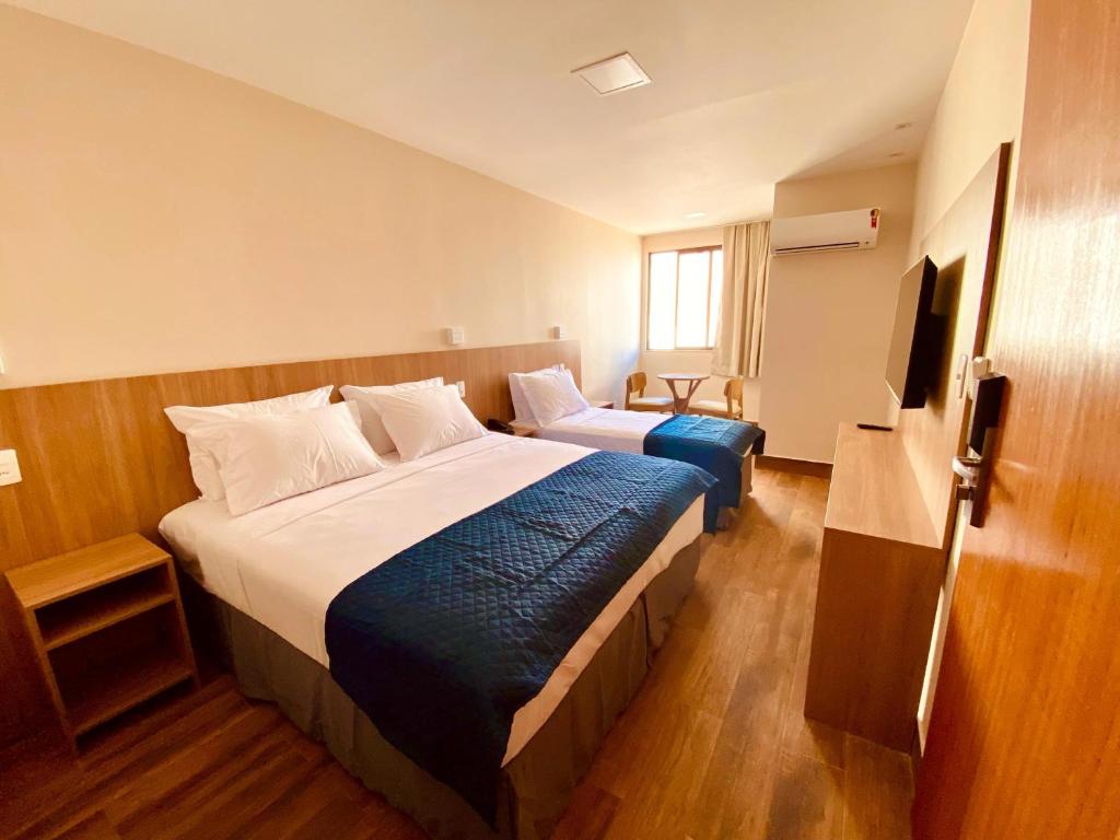 Postel nebo postele na pokoji v ubytování Hit Hotel