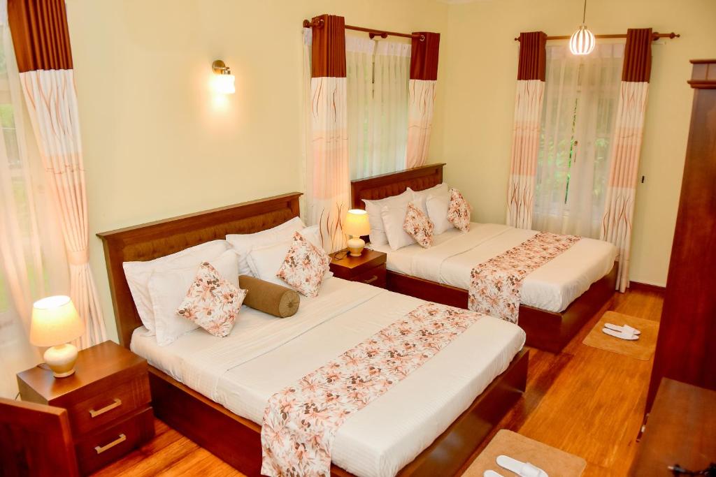 Postel nebo postele na pokoji v ubytování Tea Queens Bungalow
