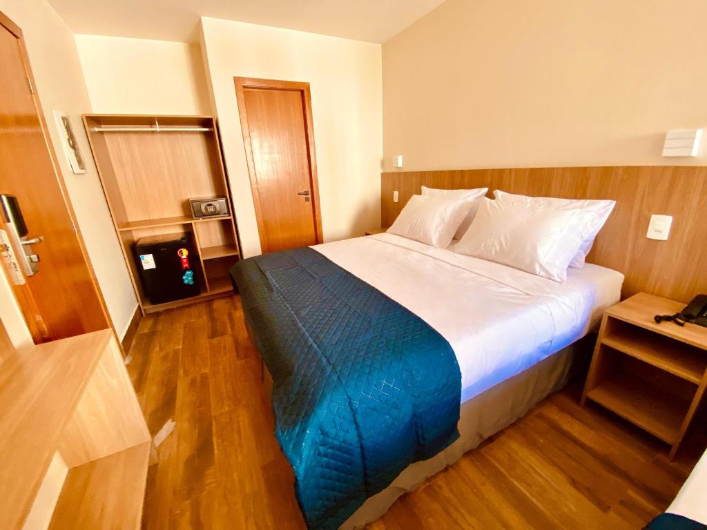 Postel nebo postele na pokoji v ubytování Hit Hotel