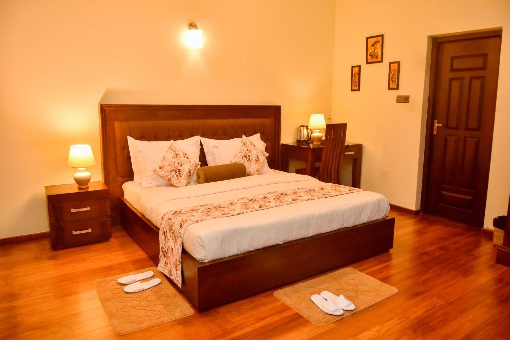 Postel nebo postele na pokoji v ubytování Tea Queens Bungalow