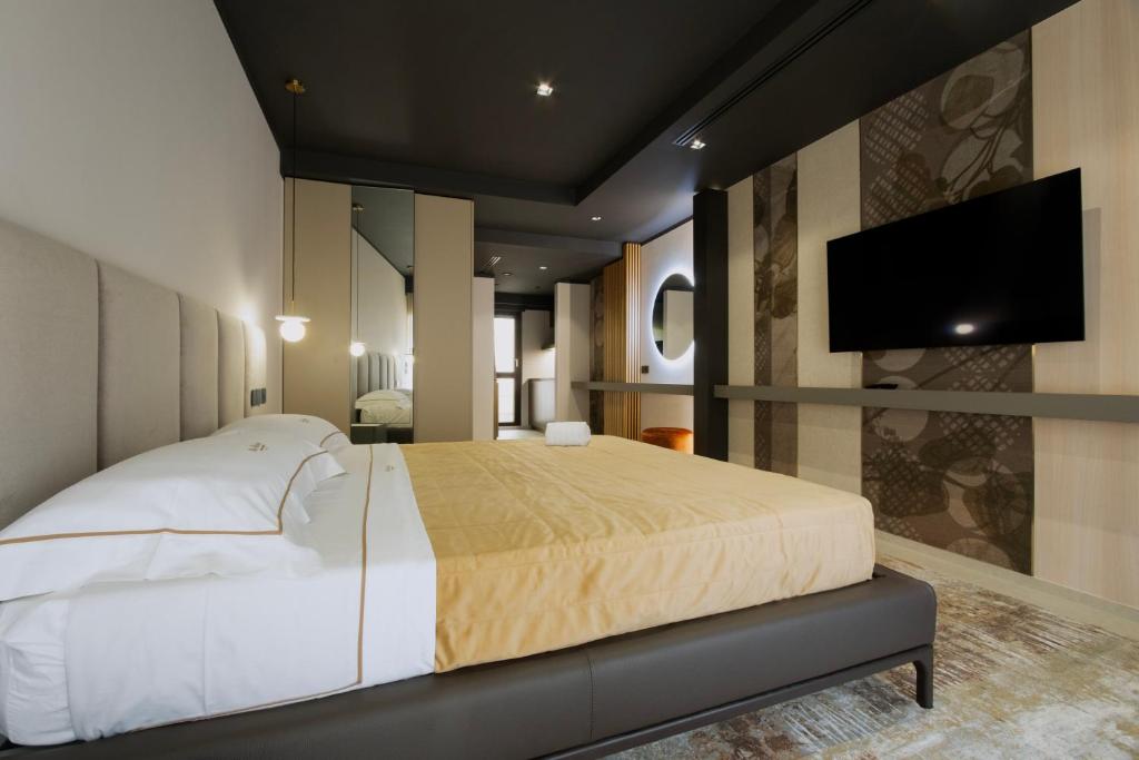 TV a/nebo společenská místnost v ubytování Villa Della Lupa Luxury Rooms