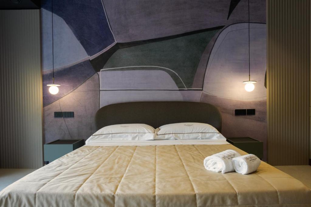 Postel nebo postele na pokoji v ubytování Villa Della Lupa Luxury Rooms