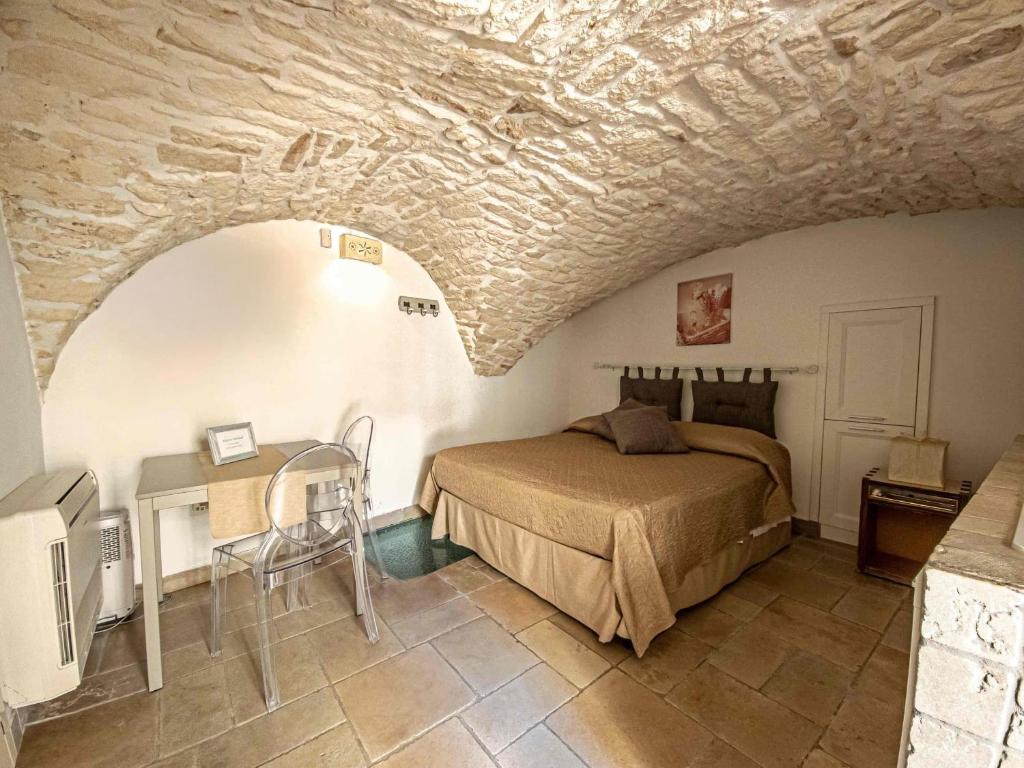 Cama o camas de una habitación en Martine Dimore Storiche di Puglia