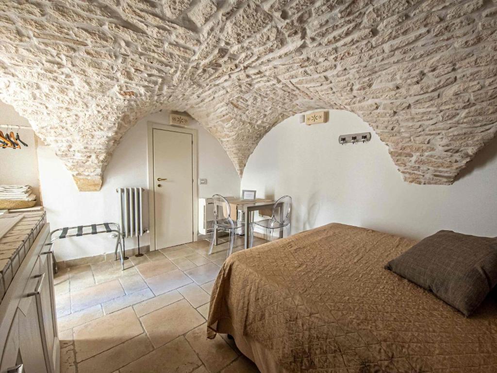 Cama o camas de una habitación en Martine Dimore Storiche di Puglia