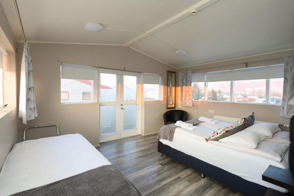 Postel nebo postele na pokoji v ubytování Skýjaborg Apartments