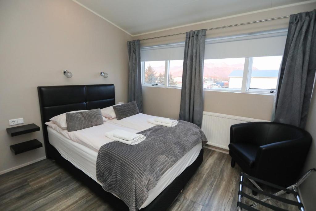 Postel nebo postele na pokoji v ubytování Skýjaborg Apartments