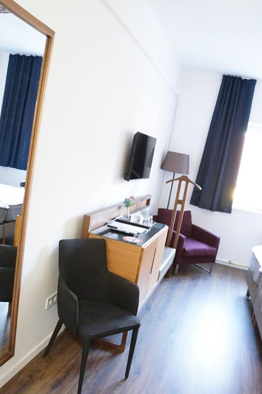 TV a/nebo společenská místnost v ubytování Pécs Centrum Apartman