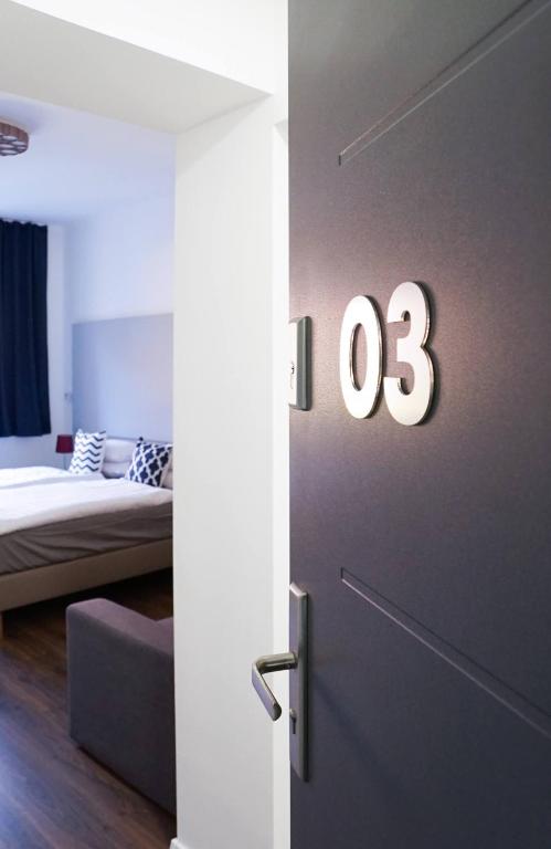 Postel nebo postele na pokoji v ubytování Pécs Centrum Apartman