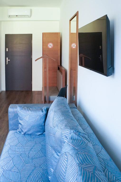 TV a/nebo společenská místnost v ubytování Pécs Centrum Apartman