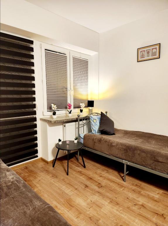 a living room with a large couch and a table at Pod Czaplą in Warsaw