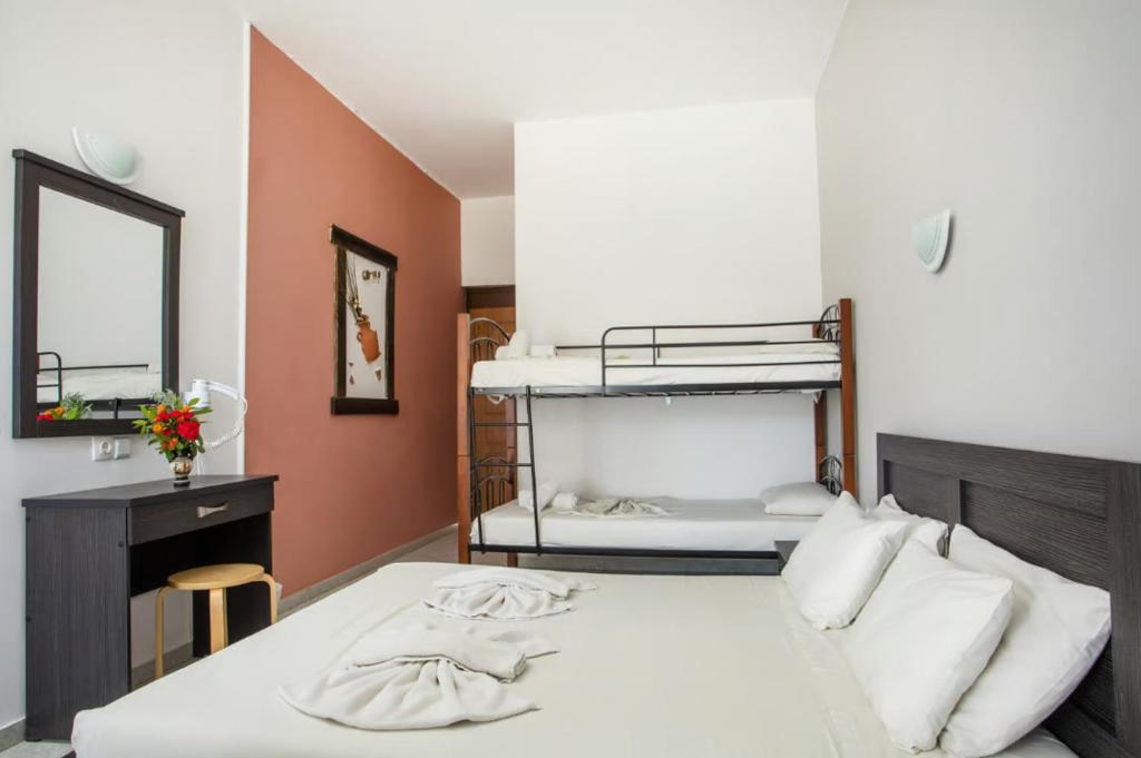 Postel nebo postele na pokoji v ubytování Hotel Napoleon