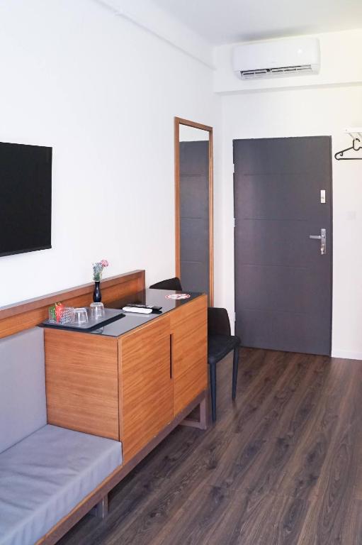 TV a/nebo společenská místnost v ubytování Pécs Centrum Apartman