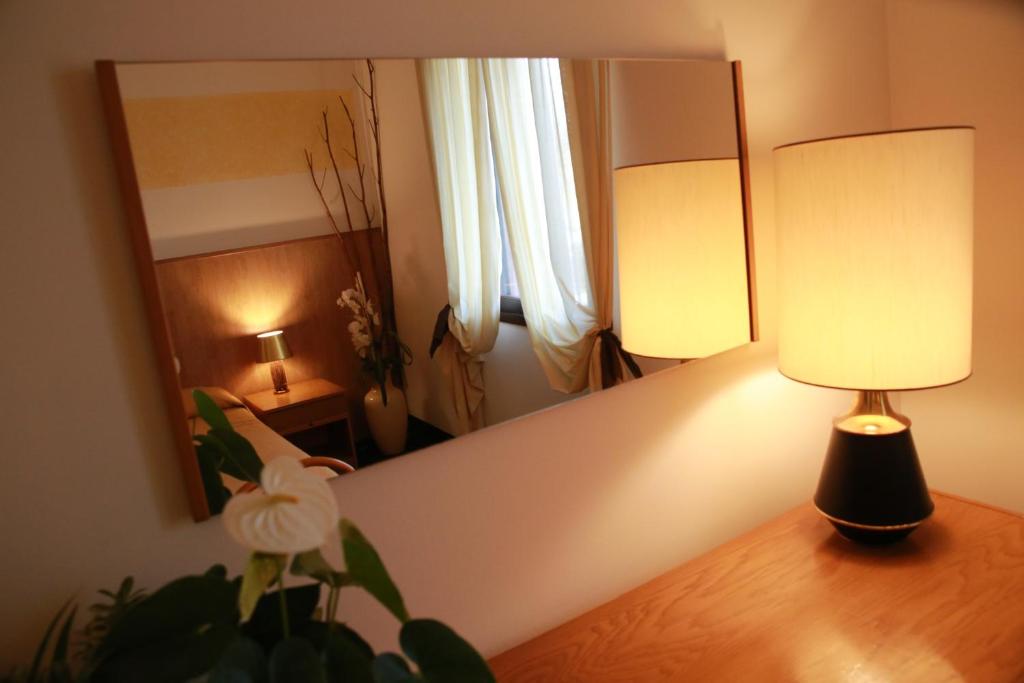 Postel nebo postele na pokoji v ubytování Hotel Al Posta