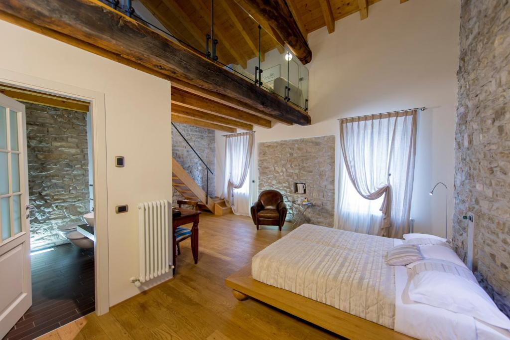 Postel nebo postele na pokoji v ubytování Relais Il Presidio