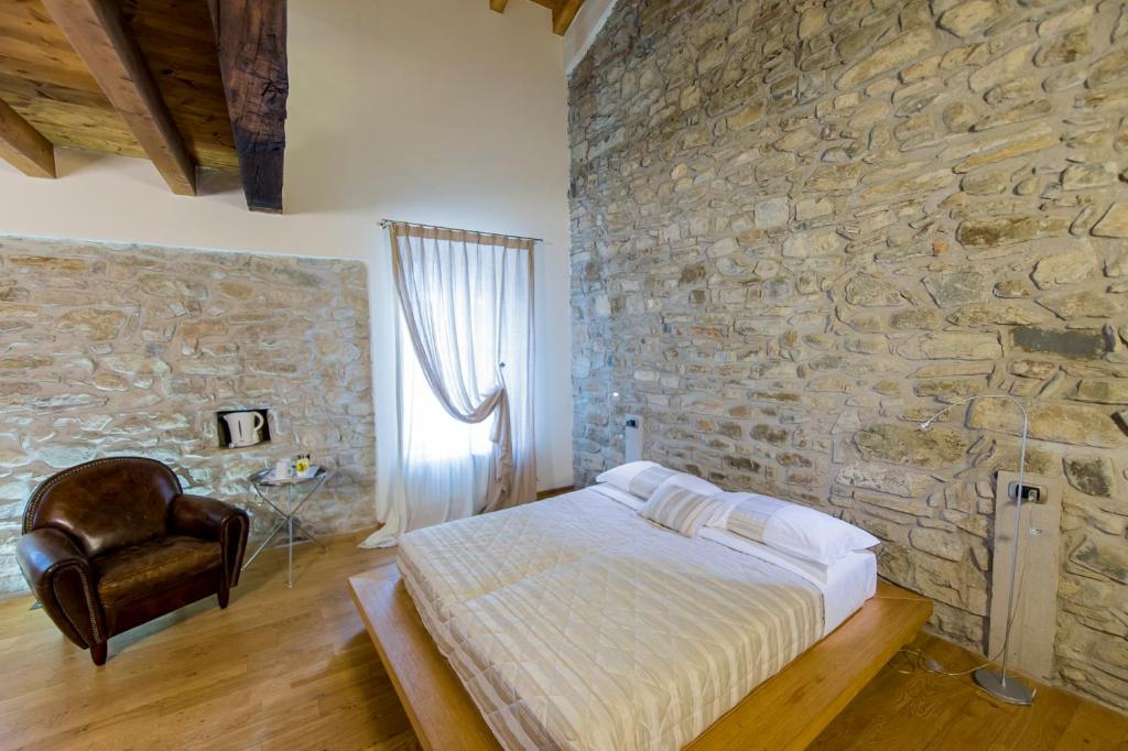 Postel nebo postele na pokoji v ubytování Relais Il Presidio