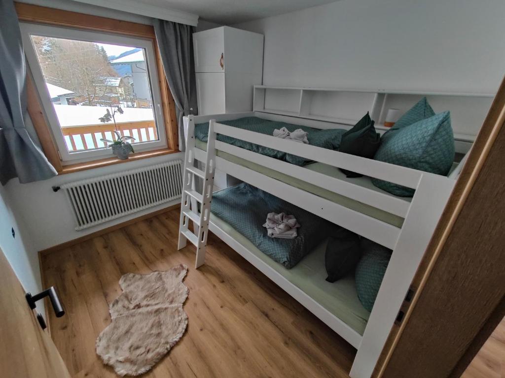 Postel nebo postele na pokoji v ubytování Apartment Anni im Haus Hintertal