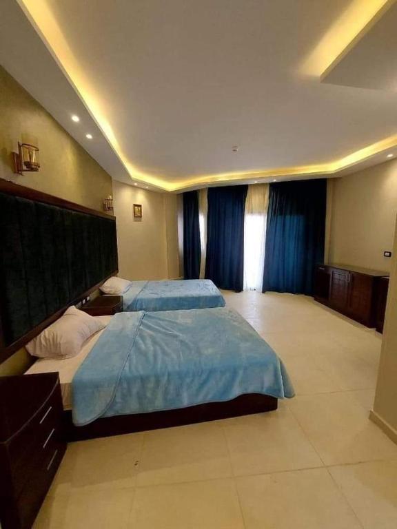 Postel nebo postele na pokoji v ubytování paradise bay hotel