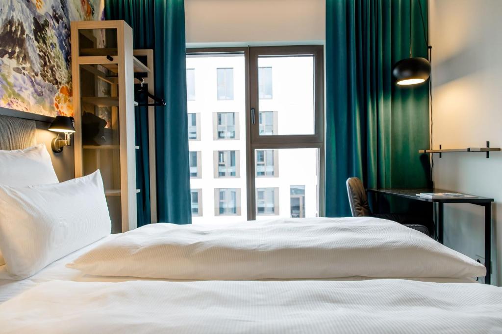 Motel One Antwerpにあるベッド