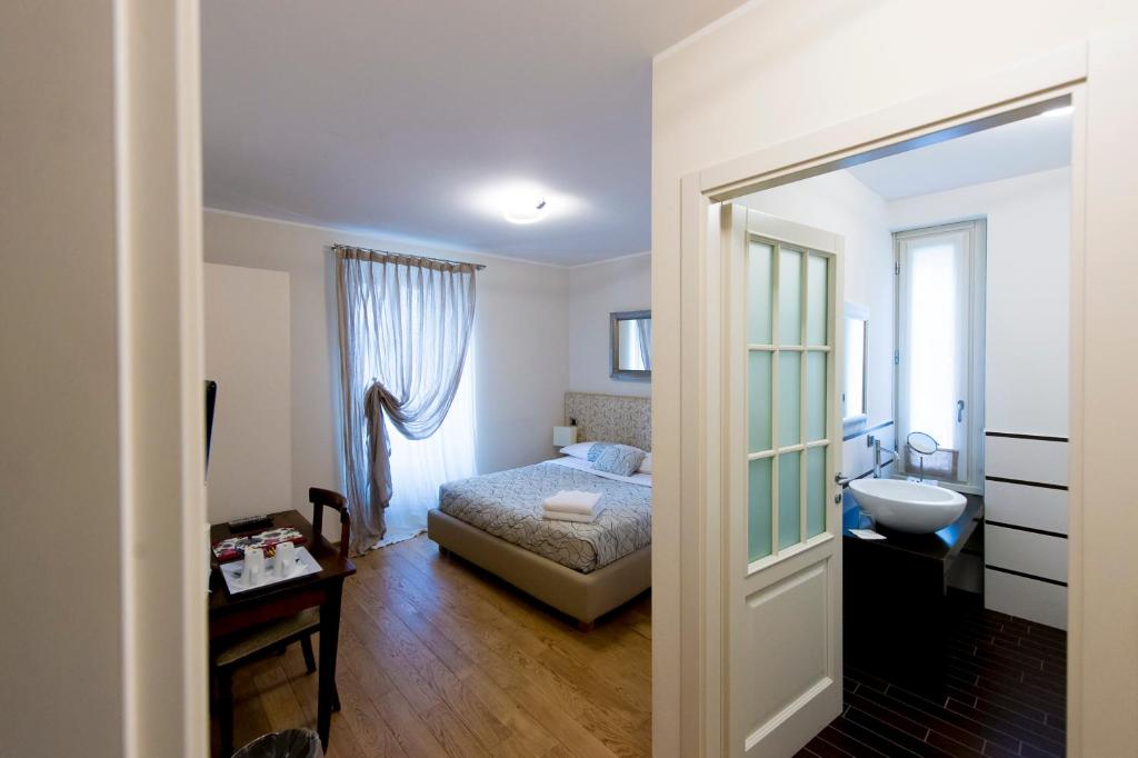 Postel nebo postele na pokoji v ubytování Relais Il Presidio
