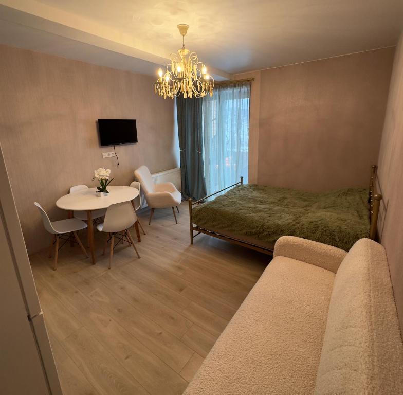 Postel nebo postele na pokoji v ubytování თბილისი