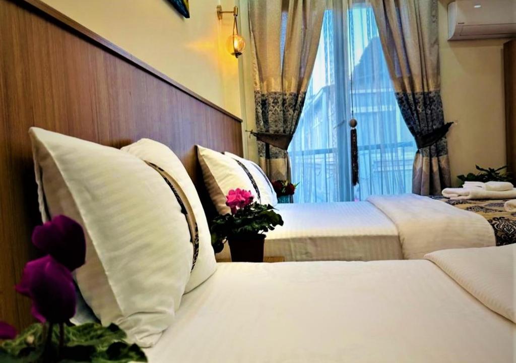 Postel nebo postele na pokoji v ubytování Hotel By Historia