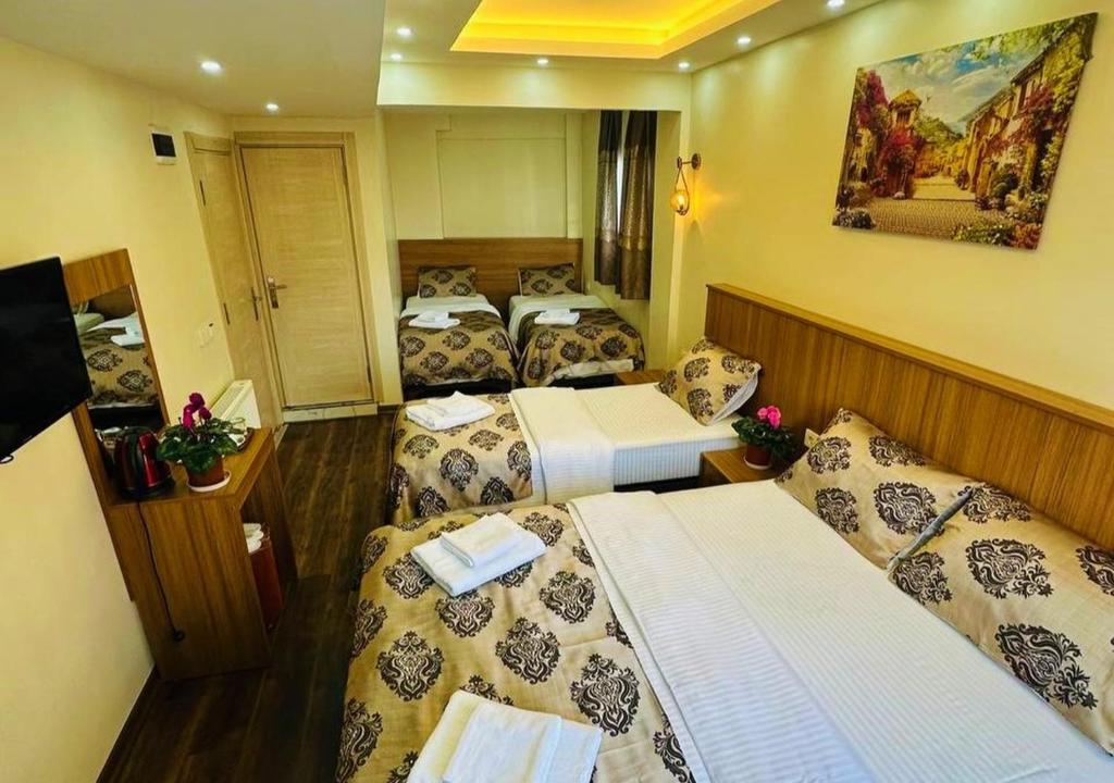 Postel nebo postele na pokoji v ubytování Hotel By Historia