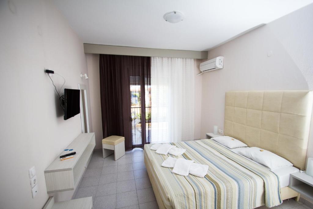 Postel nebo postele na pokoji v ubytování Hotel Maria