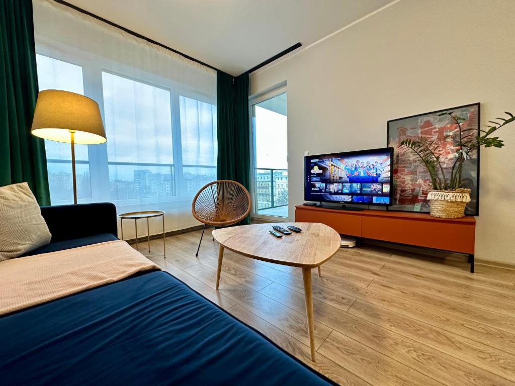 Televízia a/alebo spoločenská miestnosť v ubytovaní MOMOApart - Downtown Tram Depot