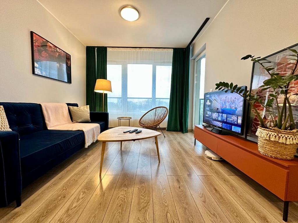 Televízia a/alebo spoločenská miestnosť v ubytovaní MOMOApart - Downtown Tram Depot