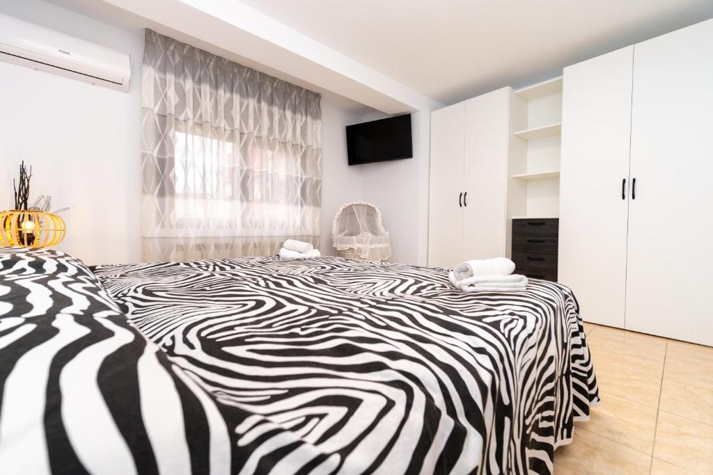 Postel nebo postele na pokoji v ubytování Casa Ianco &Rares