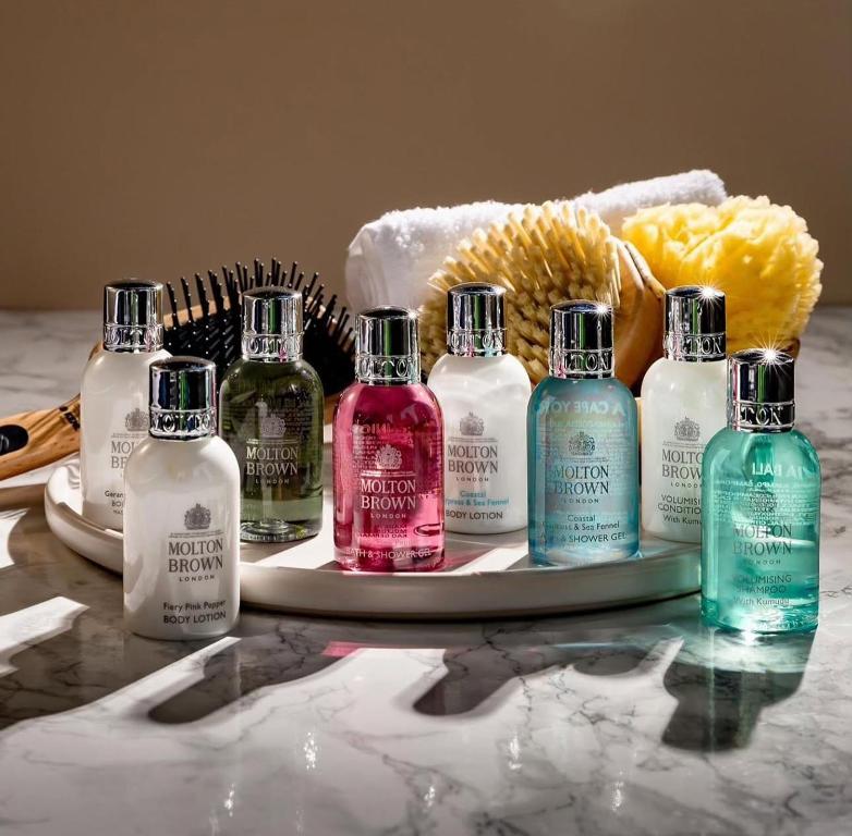 a group of different colored bottles on a table at EJ Boutique Suites in Milina