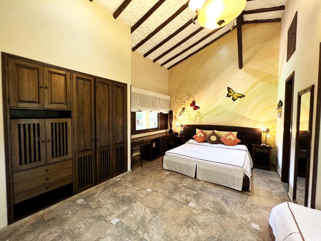 Postel nebo postele na pokoji v ubytování Tequendama Hotel Campestre Villavicencio